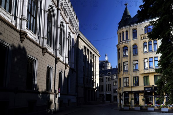 Large guild and cat house at Livu Square in Riga under deep blue sky, Riga, Latvia