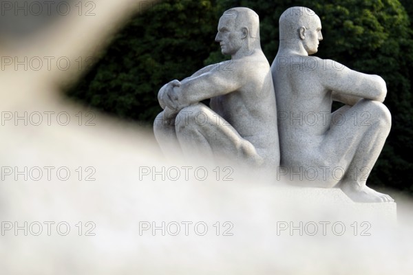 Two granite figures sitting back to back in balanced symmetry, Oslo, Norway