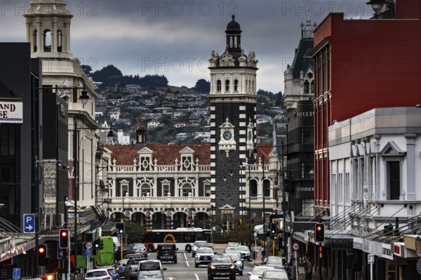 Historic train station surrounded by busy streets and distinctive architecture in Dunedin, Dunedin, Otago, New Zealand