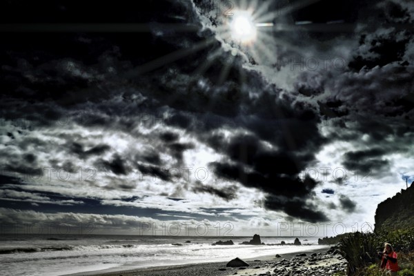 Dramatic beach with dark skies in Greymouth, New Zealand, Greymouth, West Coast, New Zealand