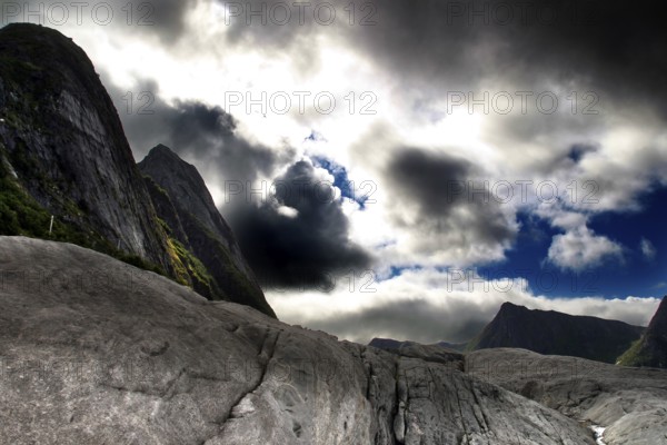 Rough rock formations under dramatic skies near Tungeneset, Senja, Norway