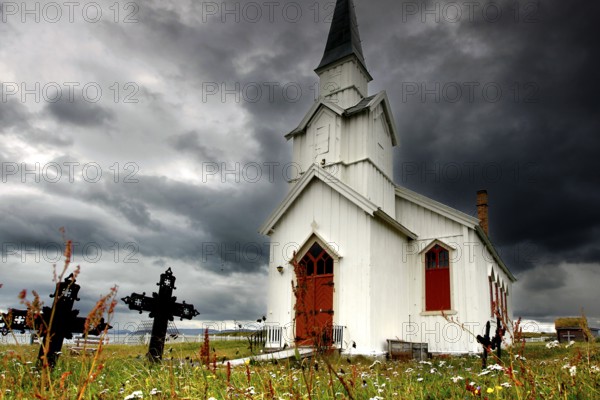 Historic church under stormy sky in Nesseby, Nesseby, Finnmark, Norway