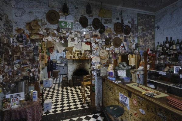 A hotel interior decorated with decorations and notes along the Stuart Highway, zero