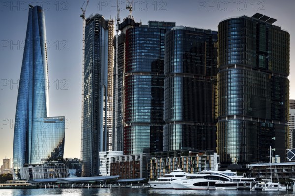 Futuristic skyscrapers in Sydney's Barangaroo are reflected in the water, Sydney, New South Wales, Australia