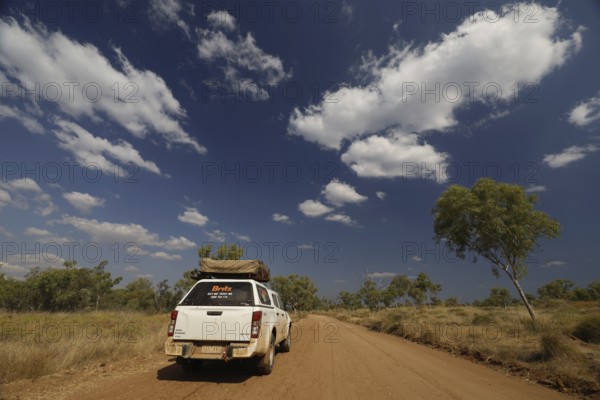 An off-road vehicle on dusty road in Purnululu National Park, Purnululu National Park, Western Australia, Australia