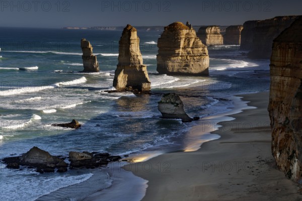 Waves meet dramatic rock formations in the ocean, peaceful coastal atmosphere, zero