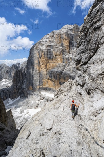 Climbers on the Via Ferrata Brentari via ferrata, spectacular mountain landscape with steep cliffs, Brenta Mountains, Parco Naturale Brenta-Adamello, Trentino, Italy