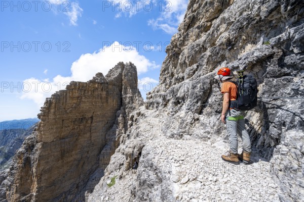 Climbers on the Via Ferrata Brentari via ferrata, spectacular mountain landscape with steep cliffs, Brenta Mountains, Parco Naturale Brenta-Adamello, Trentino, Italy