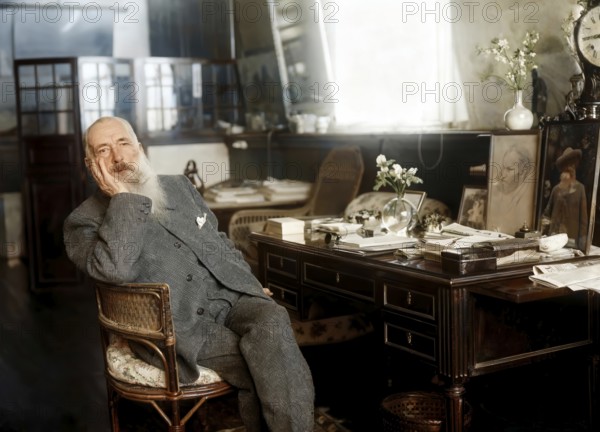 Claude Monet in his office at Giverny, French painter and founder of Impressionism, digitally optimized based on a historical photograph, subsequently colored