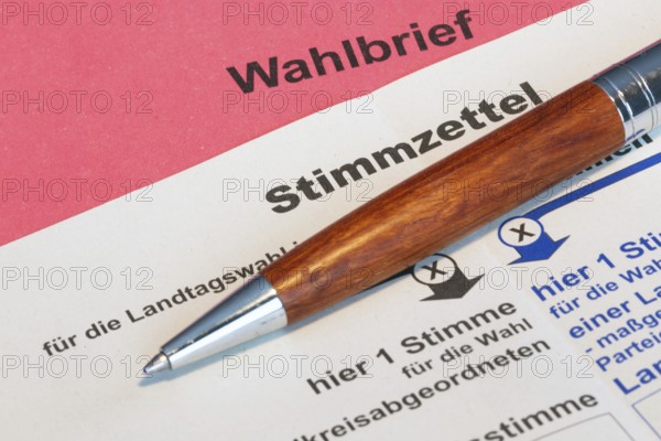 Absentee voting symbol: Close-up of a ballot letter with a ballot paper attached