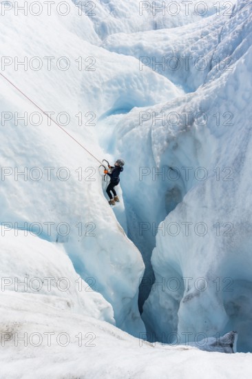 Ice climbers in an ice canyon, Root Glacier, Wrangell St. Elias National Park, Alaska, USA