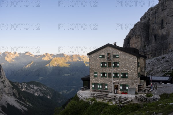 Rifugio Maria E Alberto Ai Brentai mountain hut and rocky peak, Brenta, Trentino, Italy