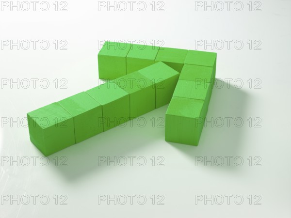 12 green wooden cubes against a white background