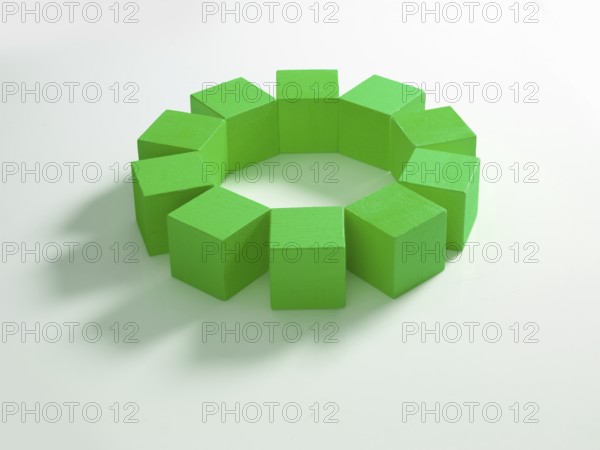 10 green wooden cubes against a white background