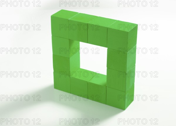 12 green wooden cubes against a white background