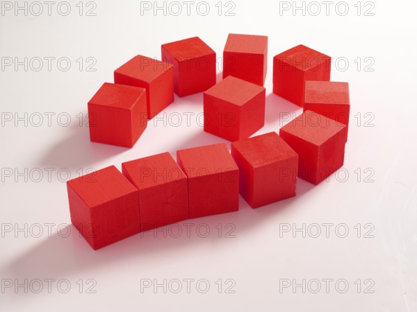 12 red wooden cubes against a white background