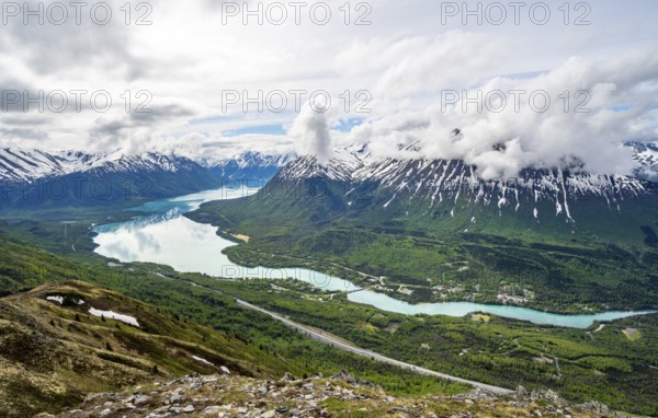 View of snowy mountains and turquoise lake Kenai Lake, Slaughter Ridge Trail, Cooper Landing, Kenai Peninsula, Alaska, USA