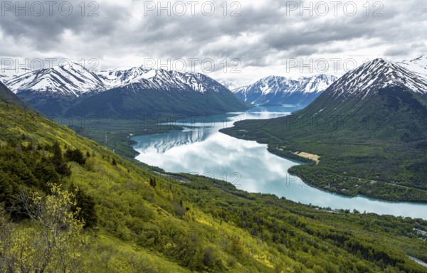 View of snowy mountains and turquoise lake Kenai Lake, Slaughter Ridge Trail, Cooper Landing, Kenai Peninsula, Alaska, USA