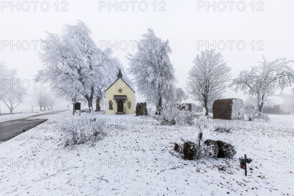 Schoenstatt Chapel Ennabeuren with hoarfrost in winter. Tourist attraction in the Swabian Jura. Heroldstatt, Baden-Württemberg, Germany