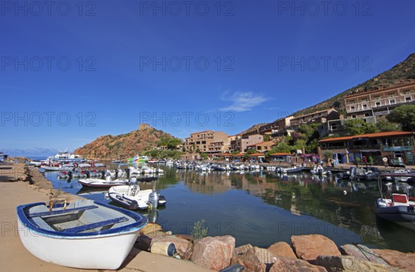 Boats in Port de Porto or Port of Porto on the Porto River, behind the Genoese Tower, Porto, Ota, west coast of Corsica, Corse-du-Sud, Corsica, France