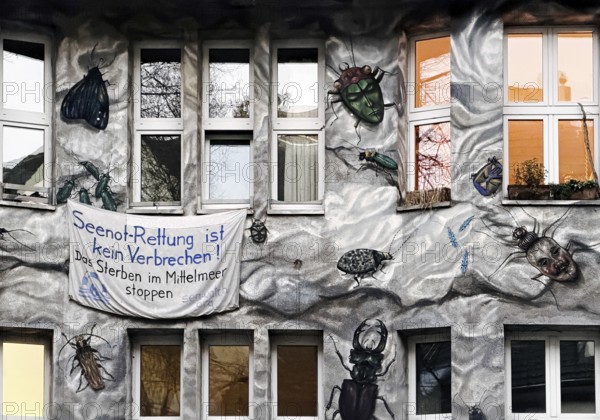 Kiefernstraße, residential street of the left-wing alternative scene with street art on house facades in the morning, Düsseldorf, North Rhine-Westphalia, Germany