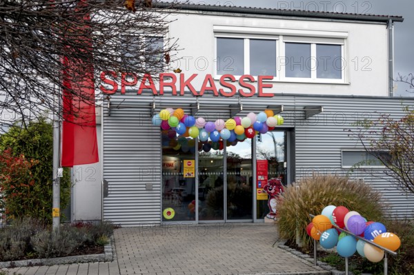 Sparkasse branch decorated on World Savings Day, Eckental, Miittelfranken, Bavaria, Germany