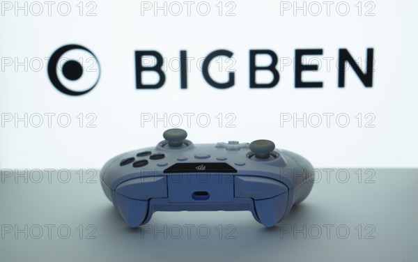 Dhaka, Bangladesh- 08 Apr 2025: A gaming controller in front of a Bigben Interactive screen