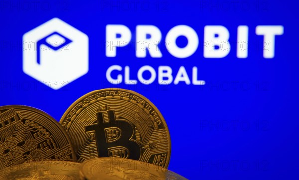 Dhaka, Bangladesh- 27 Mar 2025: Close-up of Bitcoin coins with the ProBit Global logo visible on a screen in the background