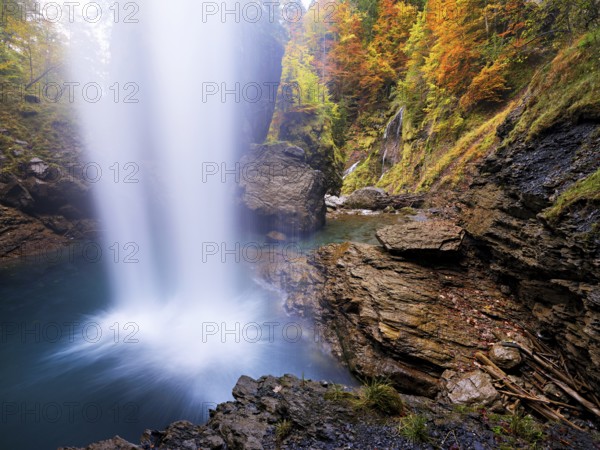 Waterfall mountain list in autumn-colored surroundings, Linthal, Klausenpass, Canton of Glarus, Switzerland