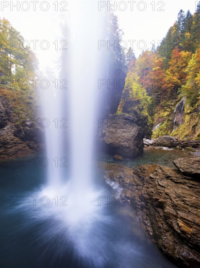 Waterfall mountain list in autumn-colored surroundings, Linthal, Klausenpass, Canton of Glarus, Switzerland