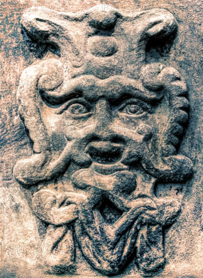 Old stone mask, face on a wall, Welf Castle of Herzberg, Herzberg am Harz, district of Göttingen, Lower Saxony, Germany, digitally edited