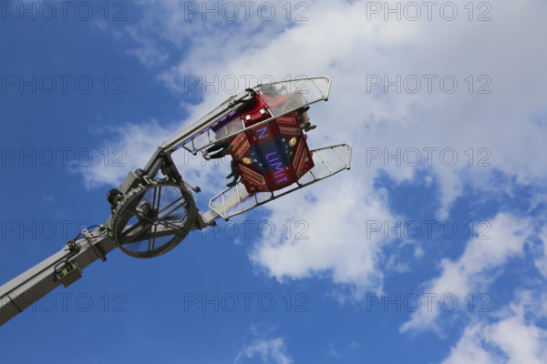 No limit carousel, fairground in Friedrichsau Ulm, folk festival, hustle and bustle, fair, amusement park, amusement attraction, ride, blue sky, clouds, Ulm, Baden-Württemberg, Germany