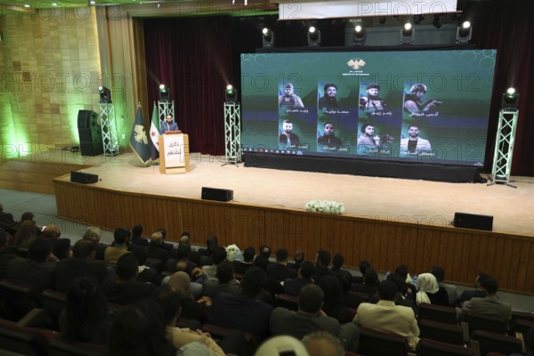 DAMASCUS, SYRIA - DECEMBER 6, 2025: Ministers and high-ranking officials of the newly formed Syrian government attend a symbolic ceremony to honor the families of victims who lost their lives during the Syrian war. The event, held in the capital Damascus, aims to provide social and symbolic recognition to the relatives of those fallen during the conflict as part of the country's transitional or commemorative phase, Damascus, Damascus, Syria