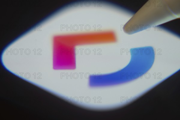 Dhaka, Bangladesh- 06 Dec 2025: Close-up of the ClickUp app on a screen with a stylus pointing at it