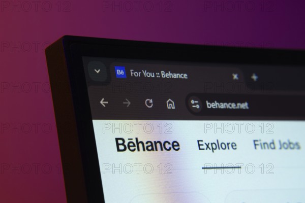 Dhaka, Bangladesh- 02 June 2025: Close-up of a computer screen displaying the Behance web interface in dark mode