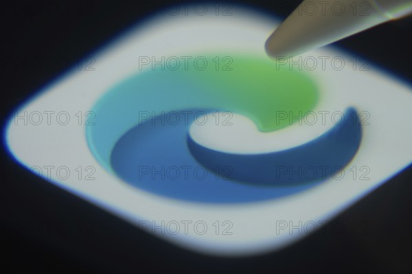 Dhaka, Bangladesh- 06 Dec 2025: Close-up of the Microsoft Edge app on a screen with a stylus pointing at it
