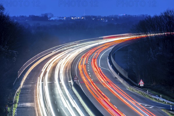 Evening traffic on the A52 motorway, between Düsseldorf and Essen, at the Ruhr Valley Bridge, across the Ruhr near Mülheim-Mintard, partly slow, rush hour traffic, looking north, North Rhine-Westphalia, Germany