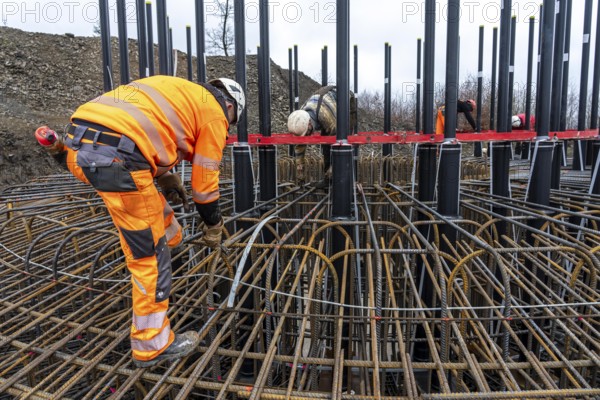 Assembly of reinforcing steel for the reinforced concrete foundation of a wind turbine, a mesh of rebar and rebar mesh, over 100 tons of reinforcing steel were used, the wind turbine will have a hub height of 160 meters, part of a new wind farm in Sauerland, near Balve, North Rhine-Westphalia, Germany