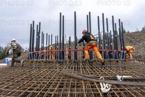 Assembly of reinforcing steel for the reinforced concrete foundation of a wind turbine, a mesh of rebar and rebar mesh, over 100 tons of reinforcing steel were used, the wind turbine will have a hub height of 160 meters, part of a new wind farm in Sauerland, near Balve, North Rhine-Westphalia, Germany
