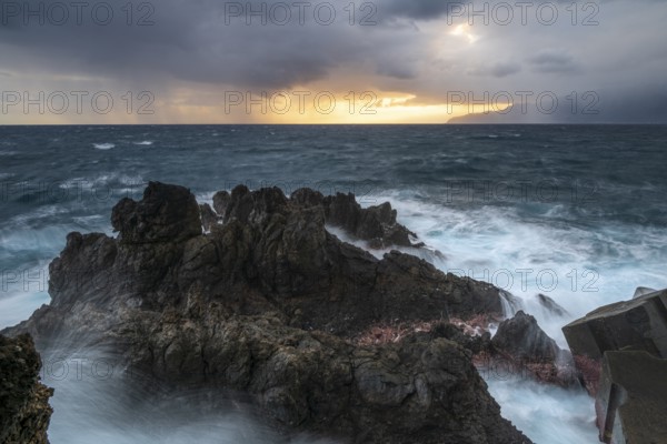 Sunrise, waves and rocks, coast near Porto Moniz, Madeira, Portugal