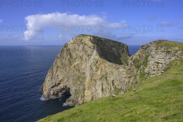 View of blue sea and cliffs with rock gate from Portacloy Loop Cliff Walk, Muingnabo, County Mayo, Ireland