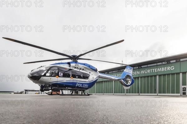 Helicopter from the Baden-Württemberg Police team in front of the hangar at the airport. Airbus Helicopters H145. Stuttgart, Baden-Württemberg, Germany