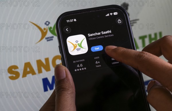In this photo illustration, a person downloads the Sanchar Saathi mobile application on an iPhone, in New Delhi, India on 3 December 2025. Sanchar Saathi is officially developed and operated by the Department of Telecommunications (DoT), Government of India as part of its citizen-protection and telecom-security initiative
