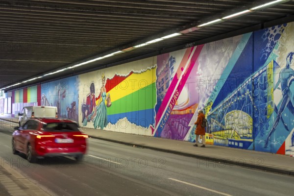 Huge street art pictures in a road tunnel in Gelsenkirchen, the approximately 120 meter long railway underpass of Wickingstraße was extensively painted and sprayed on both sides by 11 Gelsenkirchen graffiti artists and collectives, over a total length of 174 meters, the wall paintings showed motifs from Gelsenkirchen history, from economy, coal, steel, soccer, culture, life, on the 150th anniversary of the city on 29.11.11.25, North Rhine-Westphalia, Germany