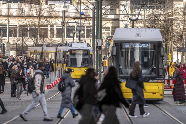 Trams at Alexanderplatz in Berlin, passers-by, Germany