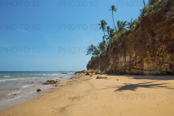 Lonely beach with red rocks and coconut trees, Red Cliffs, Bang Saphan Noi, Prachuap Khiri Khan Province, Central Thailand, Thailand
