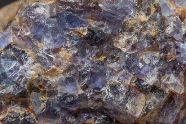 This scene shows a large rock fragment that contains quartz and fluorite crystals. Reflections and colors of minerals attract attention in the natural environment