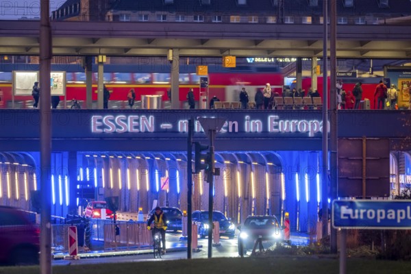 The main train station in Essen, blue-lit underpass, bus station, am Europaplatz, public transport train on the platform, North Rhine-Westphalia, Germany