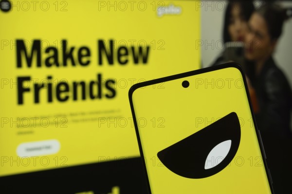 Dhaka, Bangladesh - 18 March 2025: The logo of Yubo is displayed on a smartphone screen, and the website is visible on a computer screen in the background