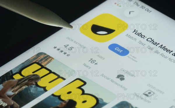 Dhaka, Bangladesh- 30 Oct 2025: Yubo app on a iPad screen with a pen pointing at the install option